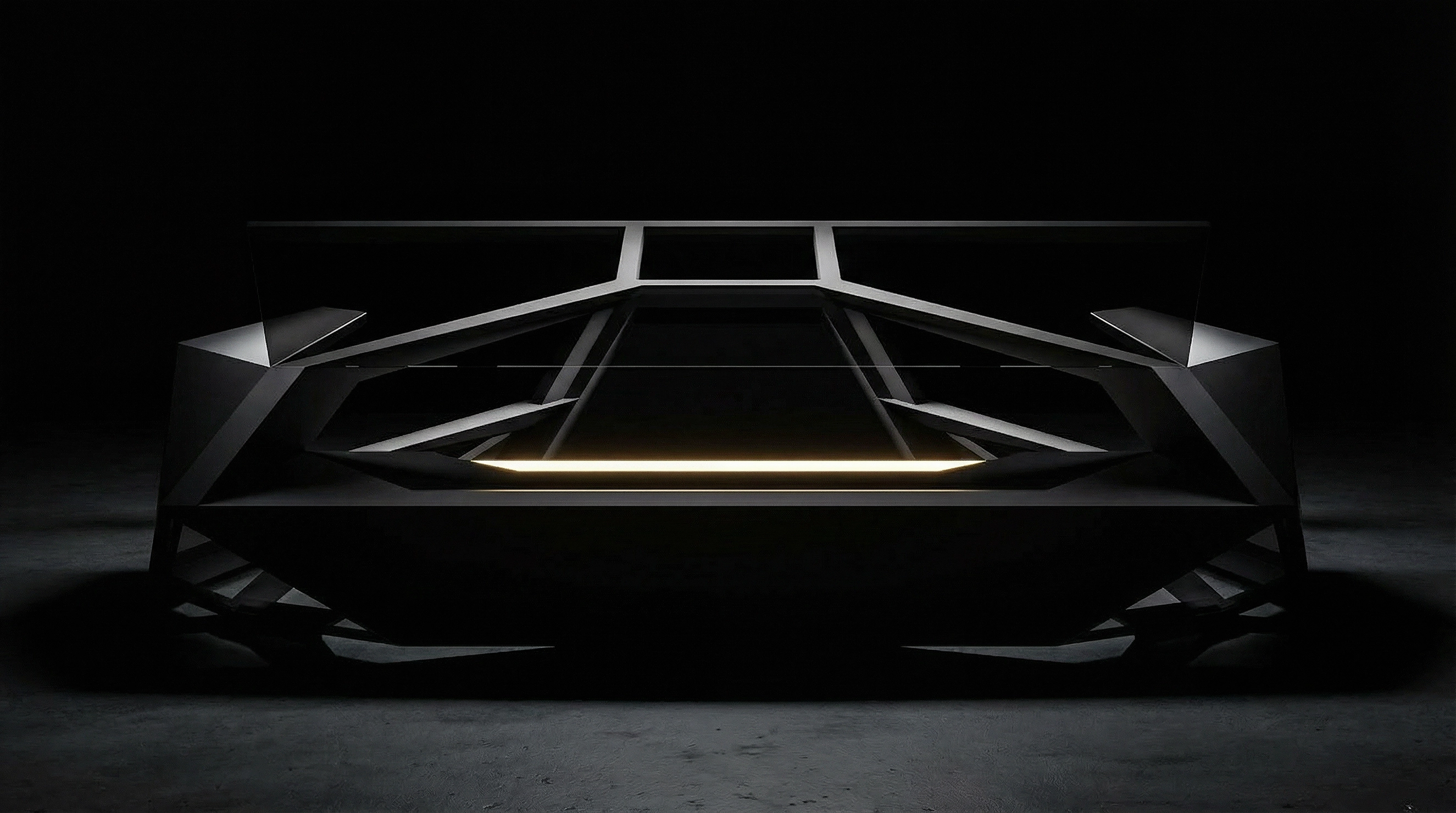 The desk in darkness, its faceted structure lit by a single line of light