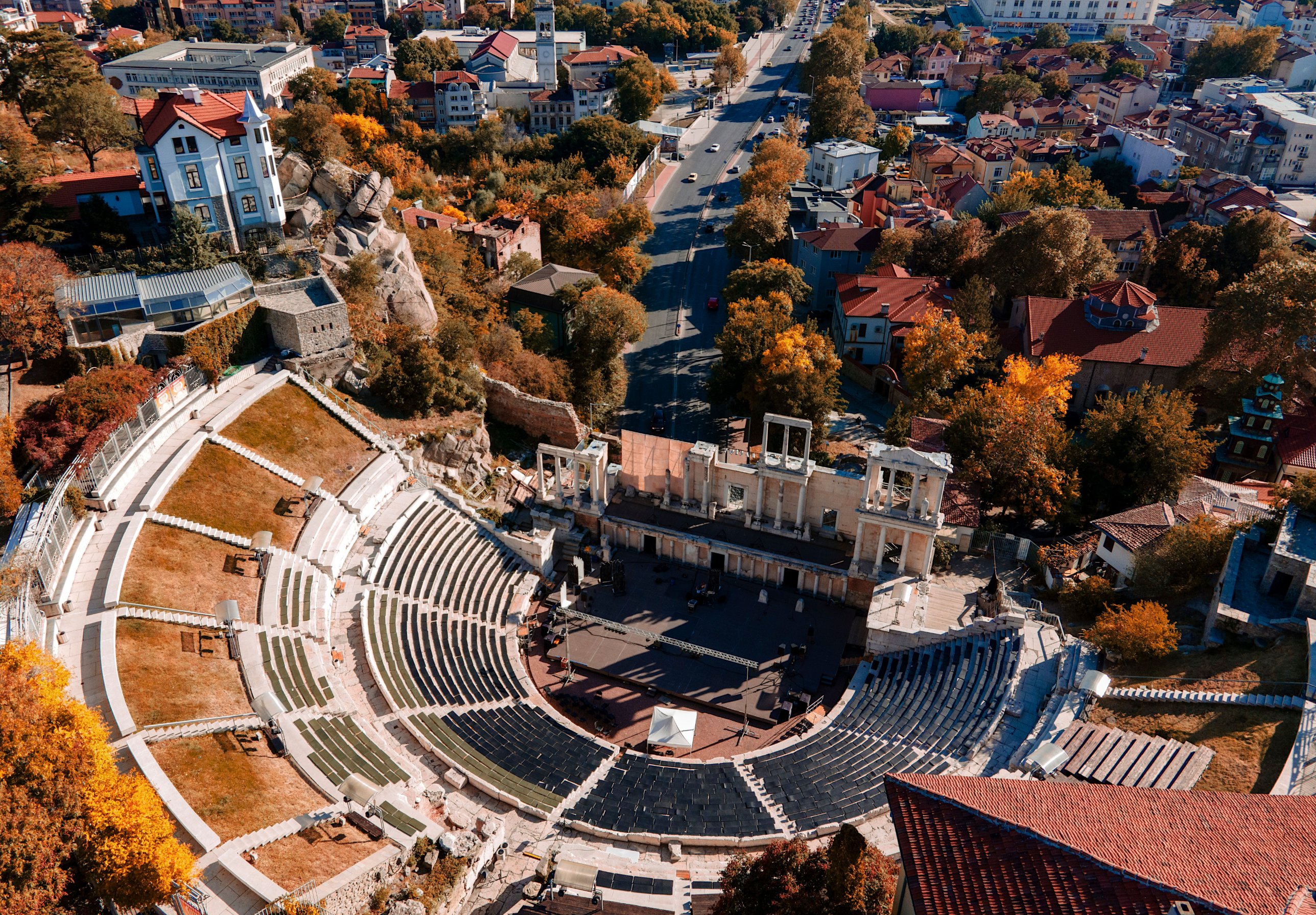 The Roman theatre of Plovdiv from above, surrounded by the old town in autumn
