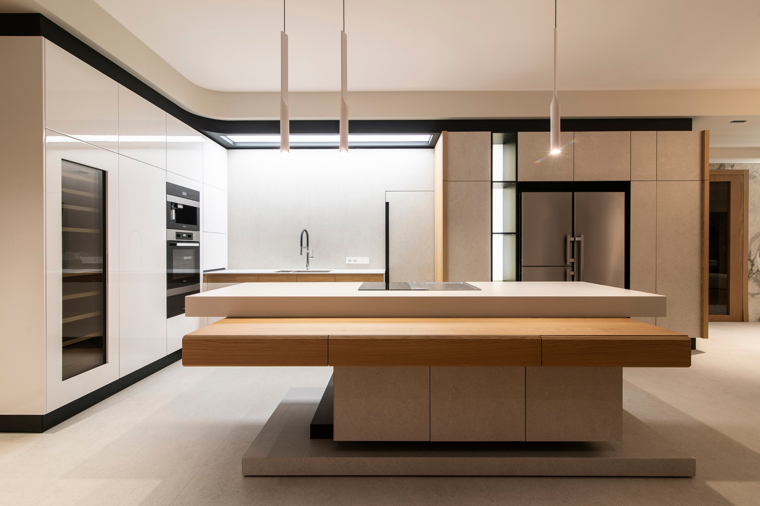 The Cubist kitchen island of layered white and timber planes