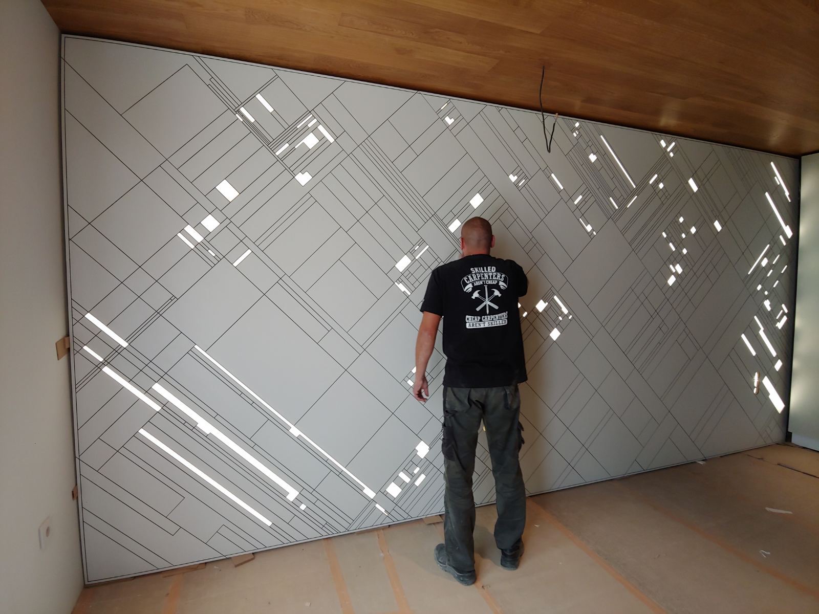 Installing the illuminated diagonal bedroom wall